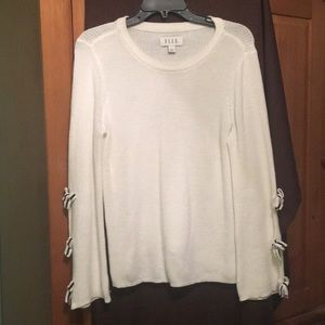 Cute white sweater with blk/wht bows